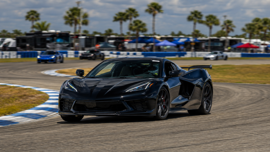 High-performance sports car driving on a Florida road course during an enthusiast track day