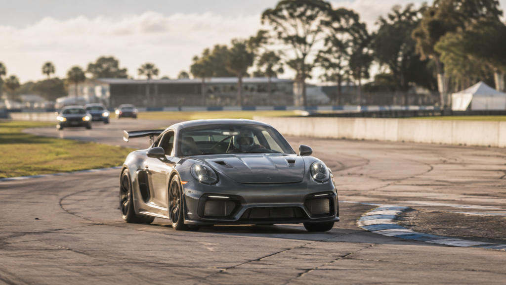 Sports car driving through Sebring International Raceway during an HPDE track day